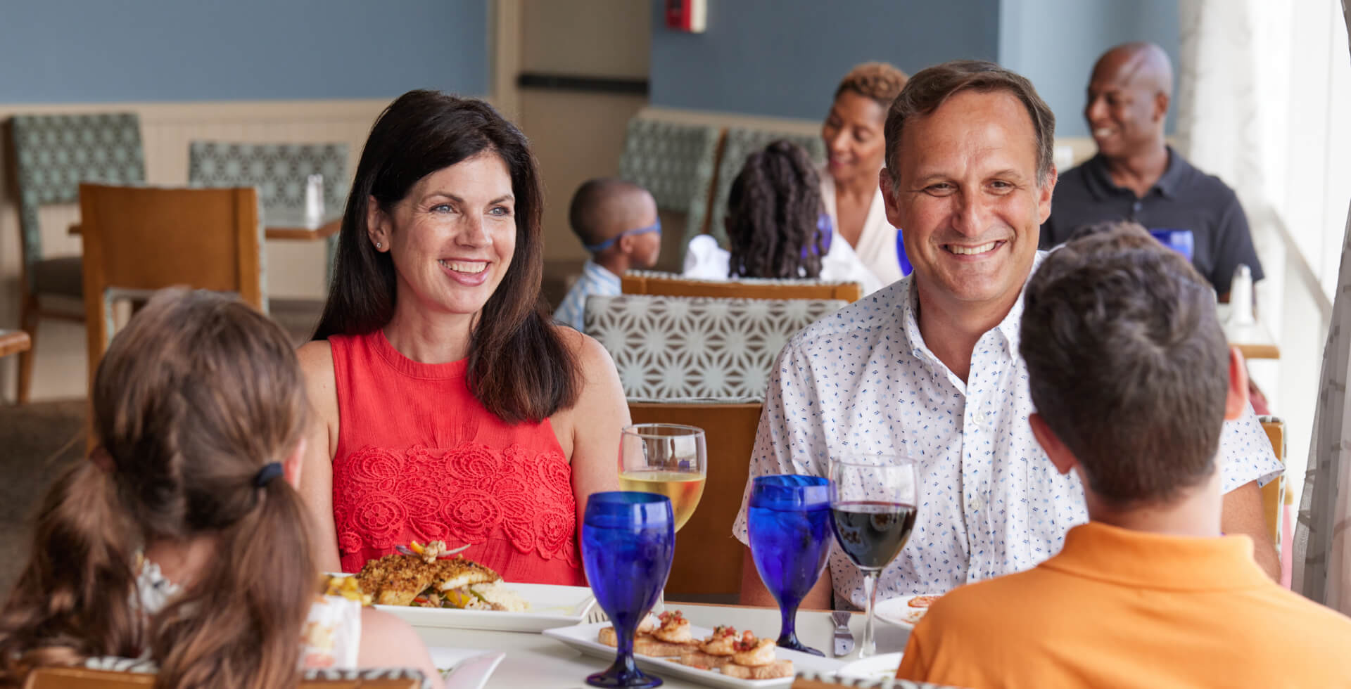 A happy family enjoying dinner at Cafe Amalfi