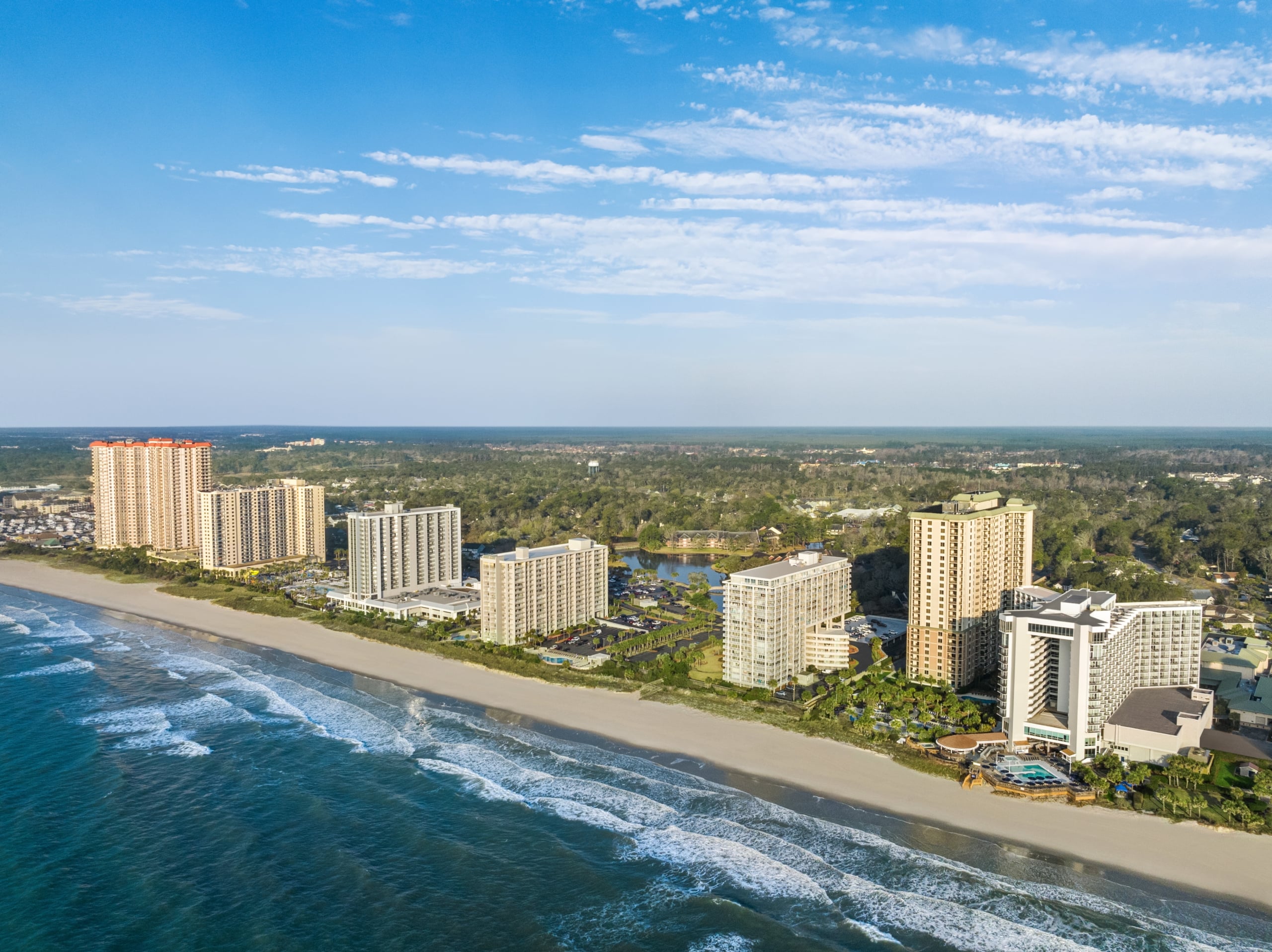 Aerial of Kingston Resorts beachfront hotels and condos