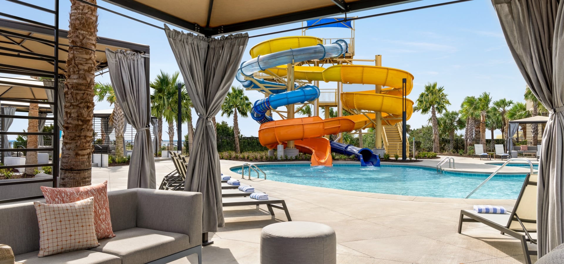 View of Currents Seaside Entertainment waterslides from inside of a cabana
