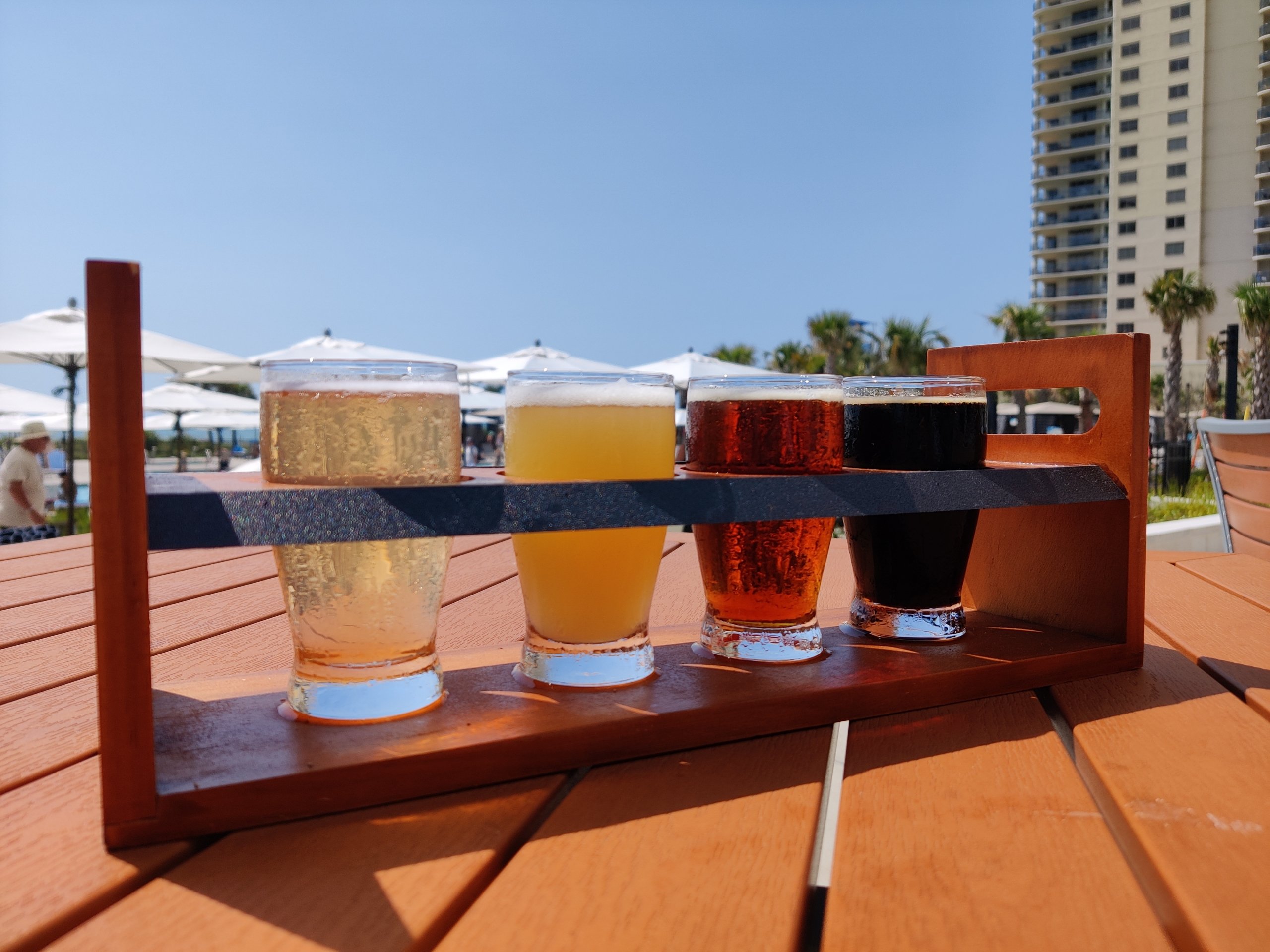 Black Drum Brewing beer flight on the outdoor patio table