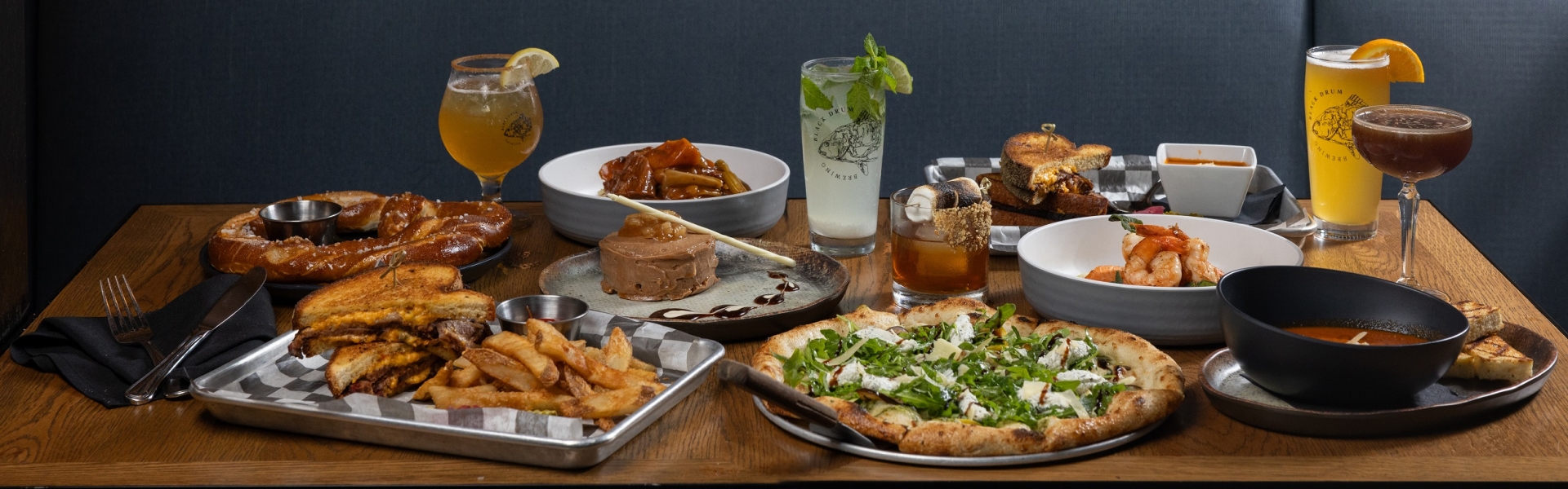 Table spread of eight different menu items featured on a fall menu