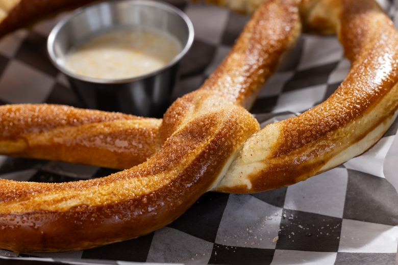 Bavarian Pretzel in cinnamon sugar with a icing dipping sauce